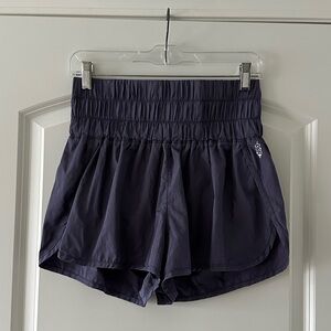 Free People Movement "The Way Home" shorts in purple or "deep sea" color, size M